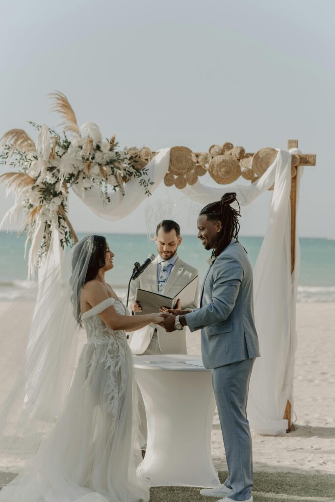 interracial couple getting married on the beach 
